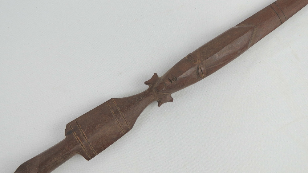 A decorative dagger in carved wood and brass sheath, - Image 5 of 6