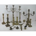 A quantity of assorted brass candlesticks together with one wall mounted twin candle sconce,