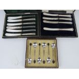 A set of six HM silver coffee spoons having 'bean' terminals within original case,