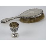 An Oriental Export silver egg cup having bird and foliate design upon,