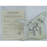 A guitar pick guard/scratch plate autographed by Coldplay, complete with J G Autographs certificate,