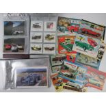 Three albums containing a large quantity of motoring and car themed photo cards, photos,