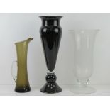 Three items of contemporary glassware, being two large lily vases and a tall smoked ewer.