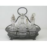 A large silver plated and cut glass cruet set having two cut glass sugar castors with HM silver