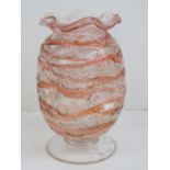 A dimpled and footed glass vase having handkerchief neck and standing 19cm high.