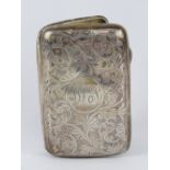A HM silver cigarette case having scrolling foliage engraved upon and gilded interior,