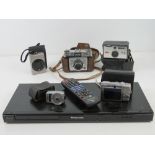 Camera equipment; a Yashica Yem35 Super light meter, a Kodak Instamatic 50, two Canon cameras,
