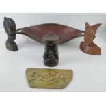 A carved African rosewood bust together with a carved wooden bowl, a carved wooden candle stand,