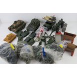 A quantity of assorted army figurines and vehicles including various tanks,