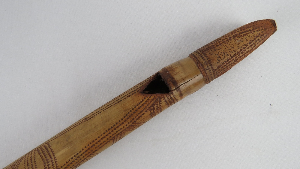 A decorative dagger in carved wood and brass sheath, - Image 3 of 6