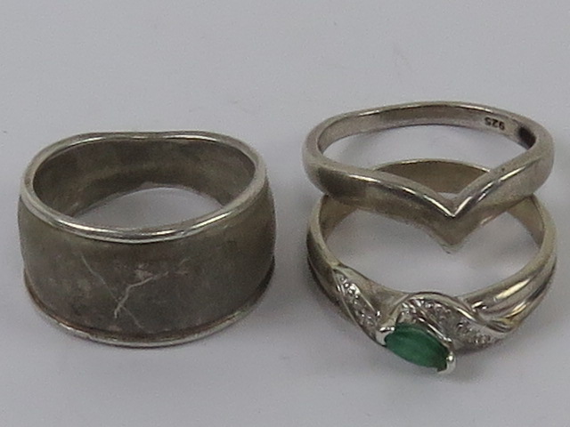 Three silver rings size P-Q, each stamped 925, one set with marquise cut green stone.