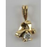A diamond pendant, unmarked yellow metal, the round cut brilliant diamond approx 0.