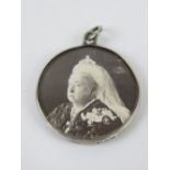 A hallmarked silver Victorian double sided glazed locket having Queen Victoria and Lord