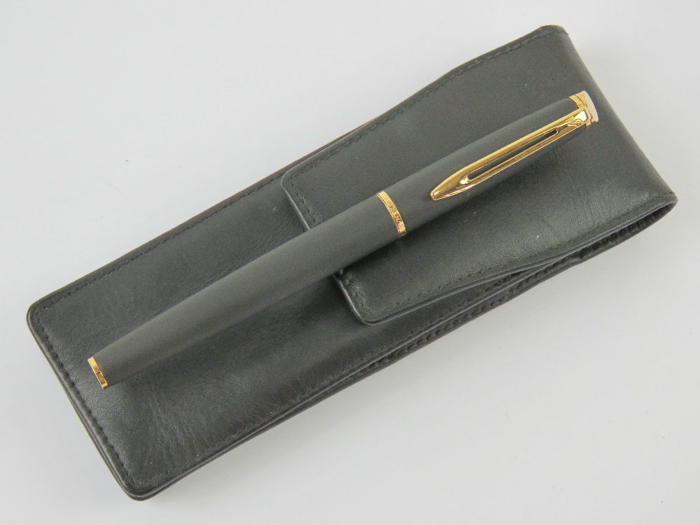 A Waterman fountain pen having original medium nib, in black leather case.