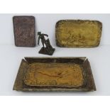 A pressed and gilded metal plate bearing two hares with foliate border, on a/f cardboard tray,