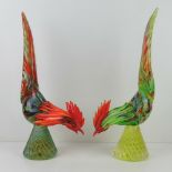 A pair of Murano-style Art glass cockerils, one in green, one in orange, each standing 47cm high.