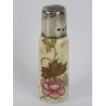 A hand painted ceramic perfume bottle having HM silver lid, 7.5cm high.