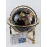 A 'Gemstone Globe' handcrafted with minerals and semi-precious stones including Lapis Lazuli powder