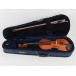 A Cathedral 1/2 size violin with bow, in original case.