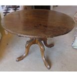 A circular occasional table raised over four outswept legs, mahogany, 75cm dia, 51cm high.
