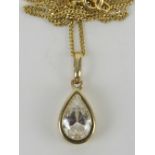 A 9ct gold and CZ pendant of teardrop form on 9ct gold chain, total weight 2.3g.