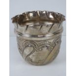 A HM silver repoussé planter having floral design, hallmarked London (date indistinct), 12cm dia, 4.