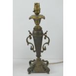 A brass table lamp in the form of an urn on plinth, standing 34cm high.
