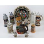 A quantity of late 20th century German steins and tankards in ceramic and glass.