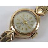 A delightful 9ct gold vintage ladies wristwatch on 9ct gold strap,