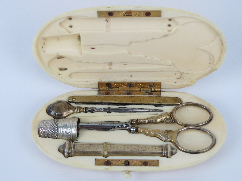 A 19th century French ivory etui sewing set, gilt metal, no apparent hallmarks, comprising scissors,