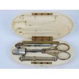 A 19th century French ivory etui sewing set, gilt metal, no apparent hallmarks, comprising scissors,