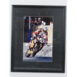 An autographed photo of John McGuinness on his HM Plant Honda Motorbike (Isle of Man TT),