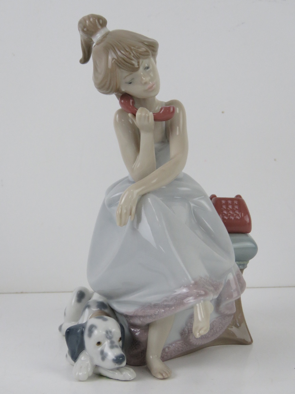 Lladro figurine 5466 'Chit Chat' a girl on the phone with Dalmatian dog at feet, with box, 20.