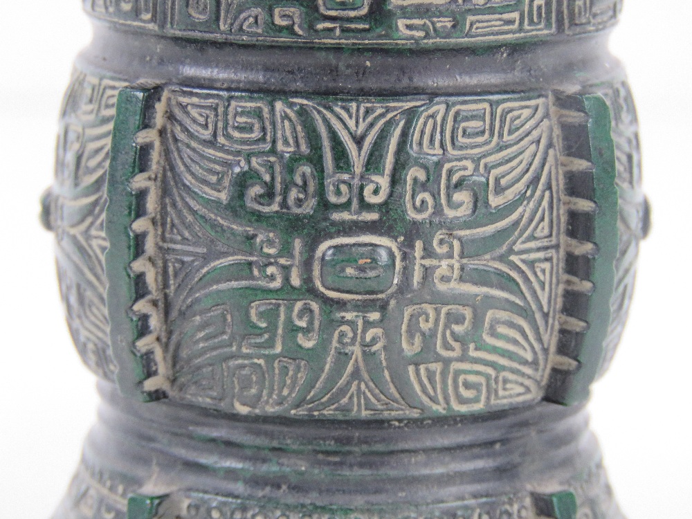 A short green ground brass vase having geometric carved pattern upon, character mark to base, 10. - Image 3 of 3