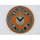 A rare vintage Newport & Gwent Motor Club car badge, painted in Newport County orange, 9.8cm dia.