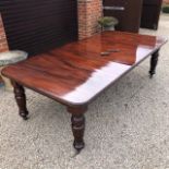 A good wind-out extending mahogany dining table.