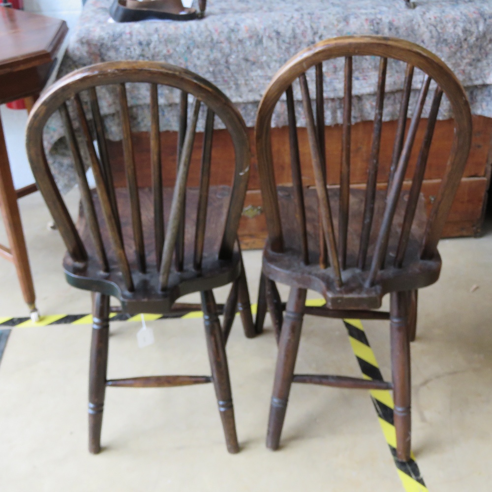 A pair of hoop back spindle turned elm seated chairs. - Image 2 of 4