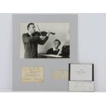Autographs of Yehudi Menuhin and (Edward) Benjamin Britten mounted on board with photograph above,