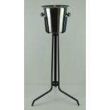 A champagne ice bucket on black painted metal stand, 77.5cm high.