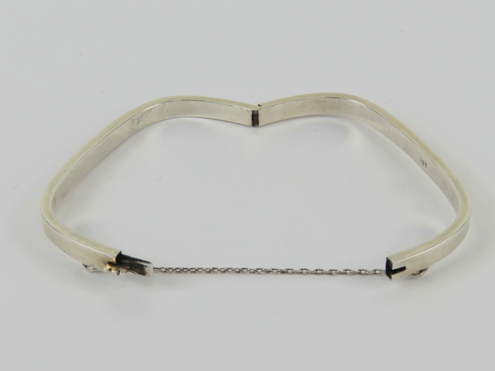 A HM silver rectangular hinged bangle with safety chain, 6 x 5. - Image 2 of 2