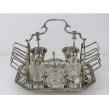 A late Victorian silver plated breakfast set comprising side toast racks,