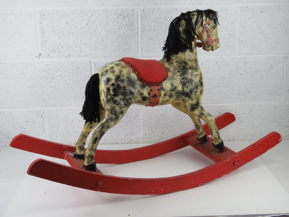 A vintage rocking horse being black and grey dapple on red rockers having fabric saddle, - Image 4 of 5