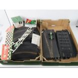 A quantity of vintage Triang Scalextric track and trackside ephemera.