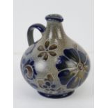 A Handarbeit mid 20thC part glazed pottery ewer standing 15cm high.