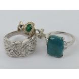 Three silver rings size R-T, one with turquoise coloured hardstone,