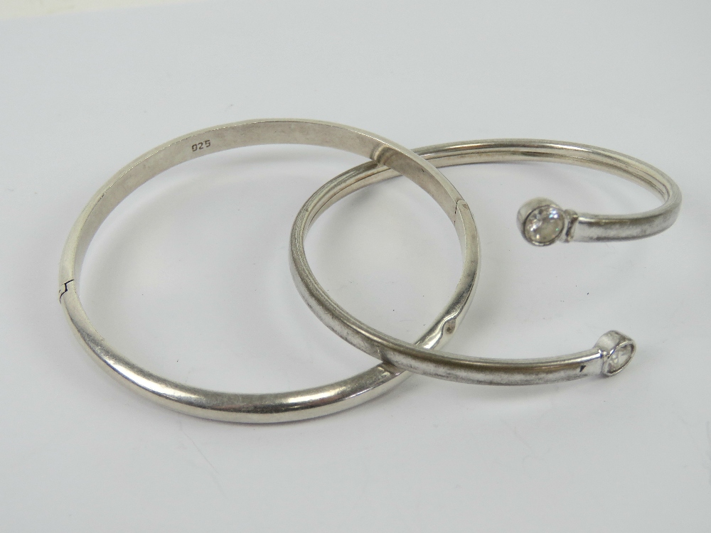 A silver bangle having white stone terminals, stamped 925. - Image 2 of 3