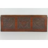 A carved mahogany panel having decorative swag designs in three sections, 67.8 x 24.3cm.