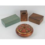 A selection of four assorted lidded boxe