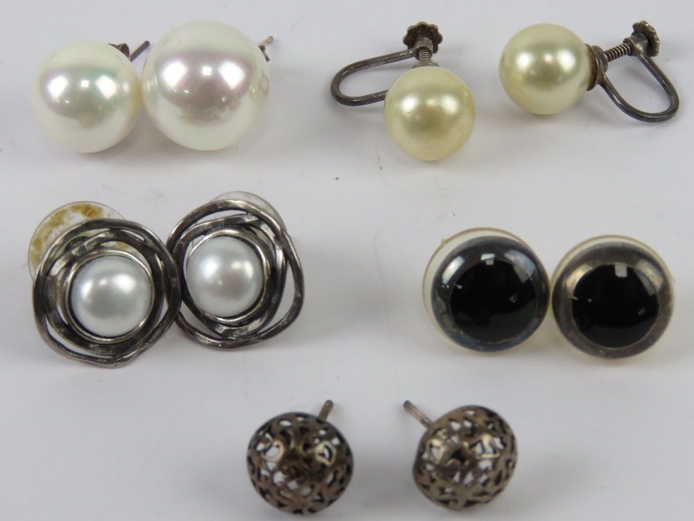 A pair of silver and pearl stud earrings