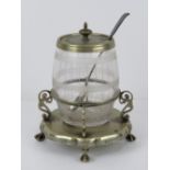 A barrel shaped glass condiment pot havi